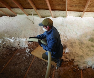 Blown-in fiberglass insulation installed in attic